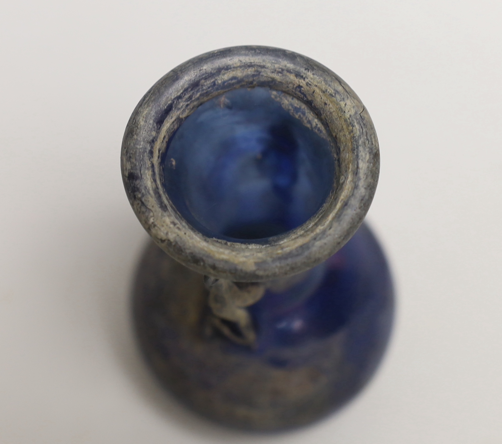 An 8th/9th century Islamic blue glass vase, 12cm